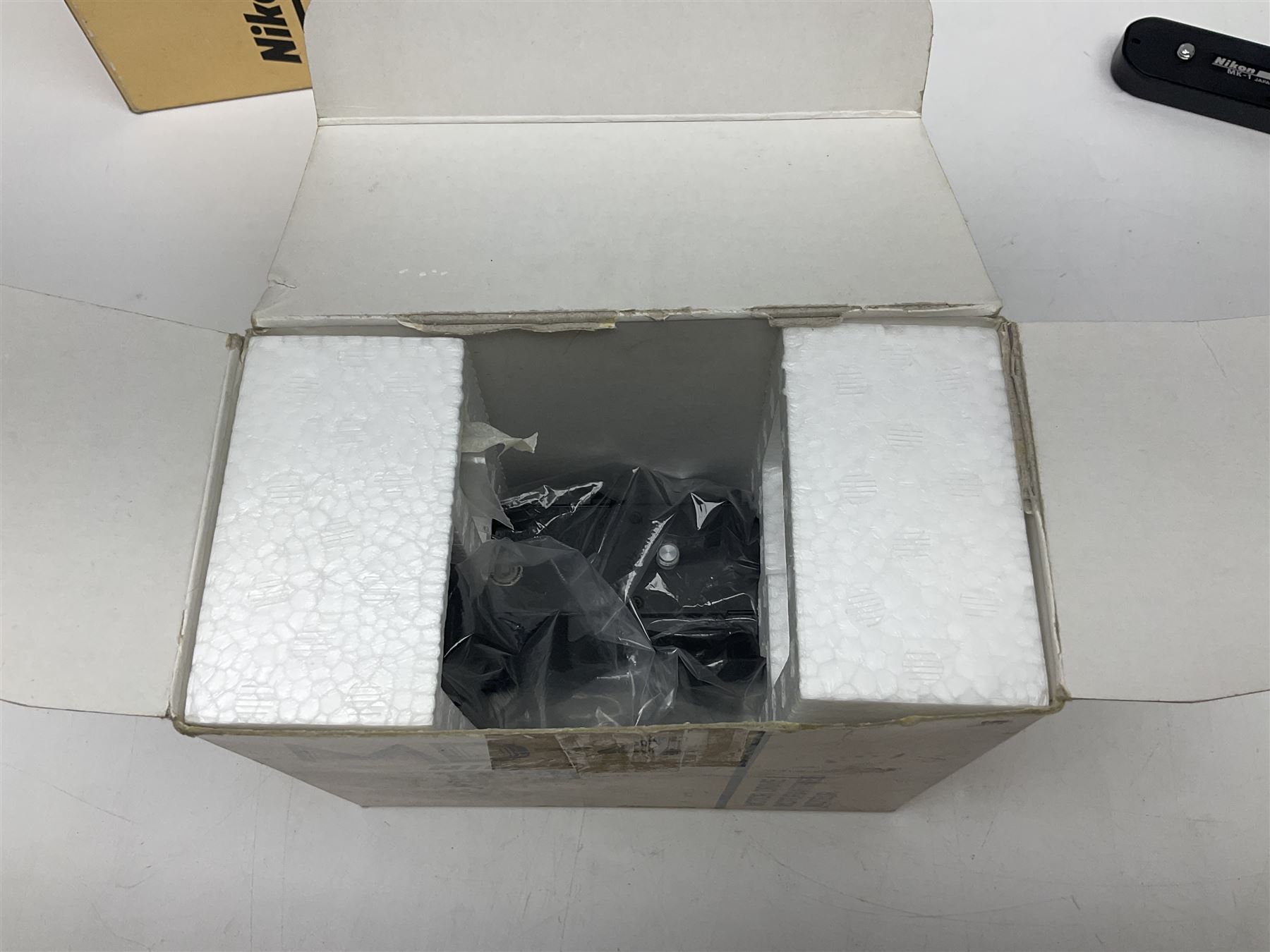 Nikon F3T camera body, in champagne/ titanium colourway, serial no. T8215031, with 'Nikon Nikkor 50mm 1:1.4' lens, Nikon MD4 motor drive, serial no. 156592 and Nikon MK-1 Firing range converter, all with original boxes 