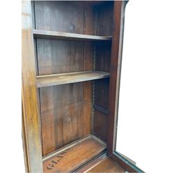 Victorian mahogany bookcase on cupboard, projecting cornice over two glazed doors and carved corbels, fitted with two drawers and double cupboard, plinth base