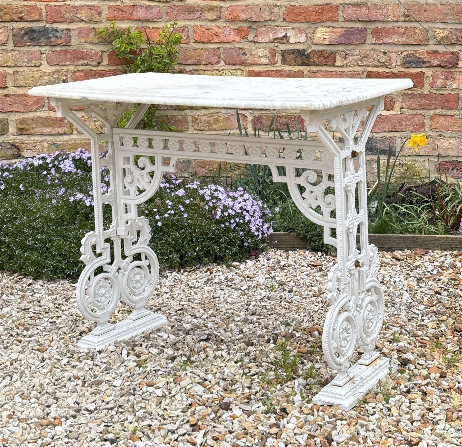 Victorian cast iron garden table with variegated marble top. L127cm, D57cm, H75cm.  - COLLECTION BY APPOINTMENT FROM: The White House, Thirsk Road, Easingwold, York, YO61 3NF - CALL 01723 507111 TO ARRANGE