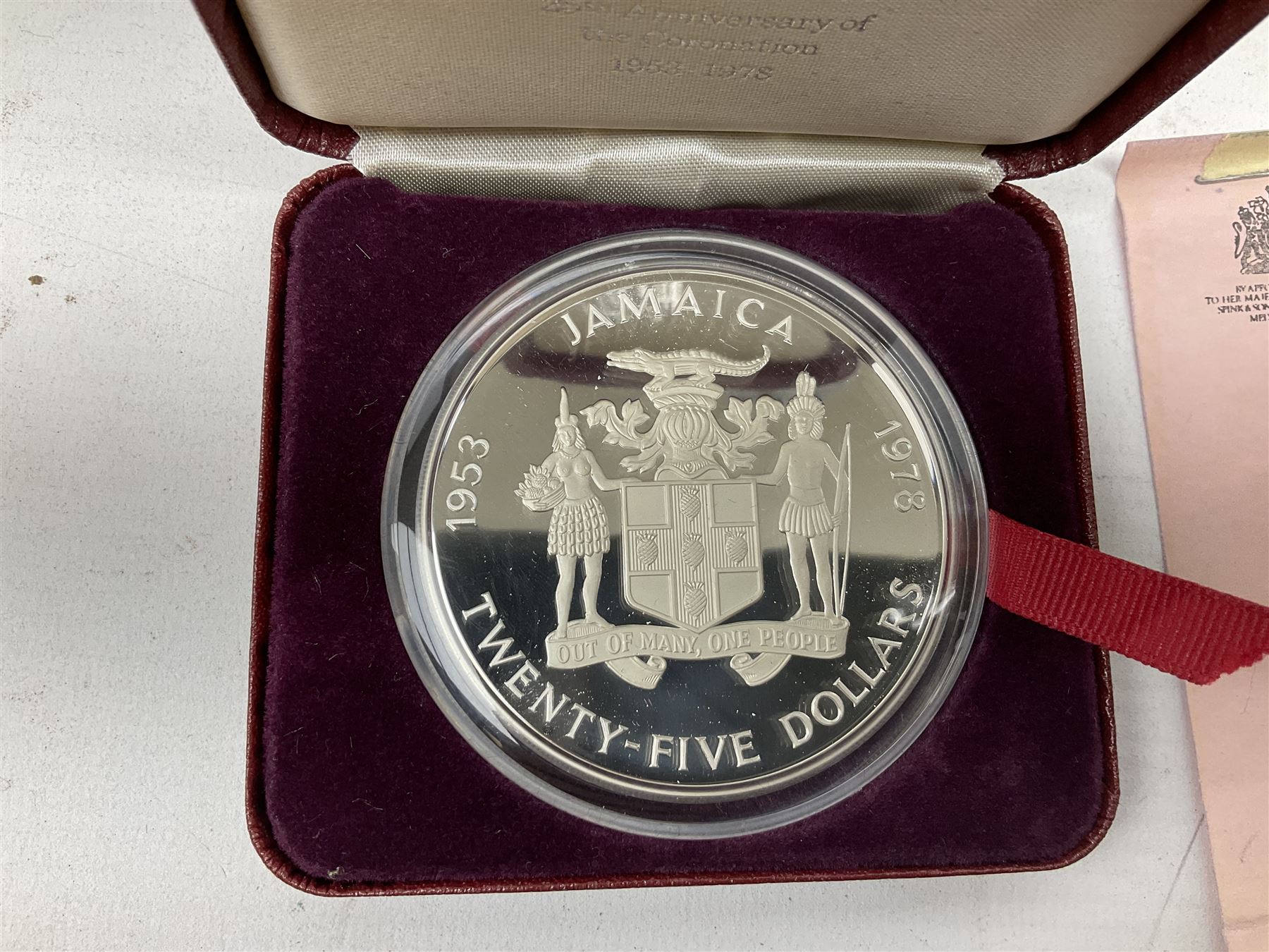 Jamaica 1975 eight coin proof set produced by the Franklin Mint and a Jamaica 1978 sterling silver proof twenty-five dollar coin, both cased with certificates