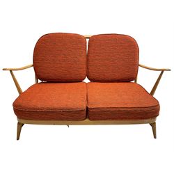 Ercol - circa. 1960s 'Windsor' two-seat Windsor settee, original covers with replaced cushions, requires re-strapped 