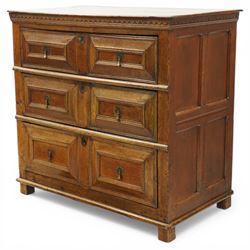 18th century oak chest of drawers, rectangular plank top with chip carved frieze, fitted with three long geometrically panelled drawers with applied mouldings, later brass drop handles, on stile supports, panelled sides and boarded back
