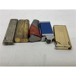Collection of lighters, including Ronson Varaflame, Zorr Classic, Dunhill bark effect roller gas lighter, and faceted blue glass table lighter, etc