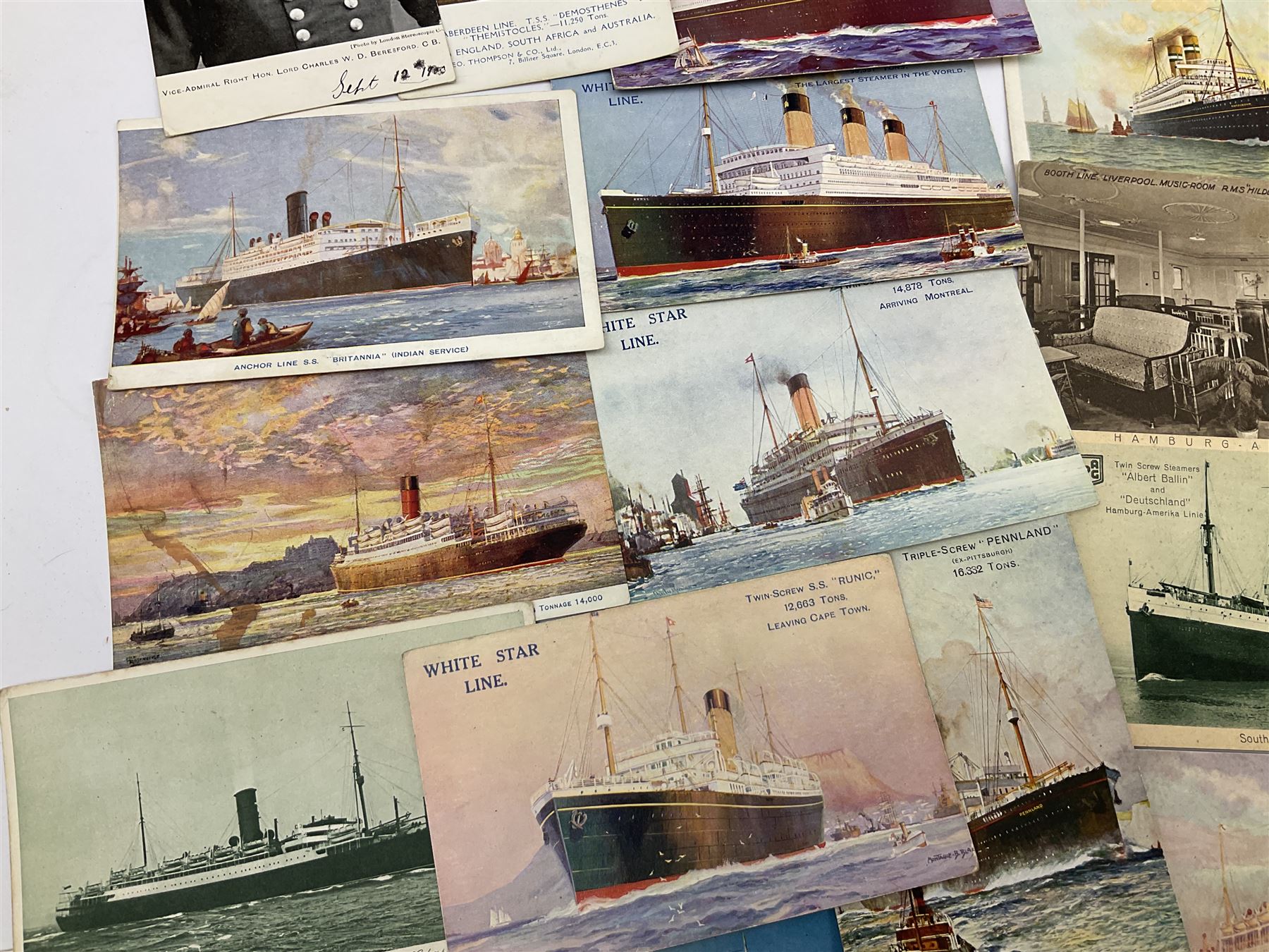 Sixty-five early 20th century postcards of passenger liners including White Star, Red Star, Atlantic Transport, Anchor, Cunard, Henderson, Booth, Union Castle, Holland America, Lamport & Holt, P. & O., New Zealand, Canadian Pacific, British India etc; and ten Edwardian postcards of Naval warships and officers (75)
