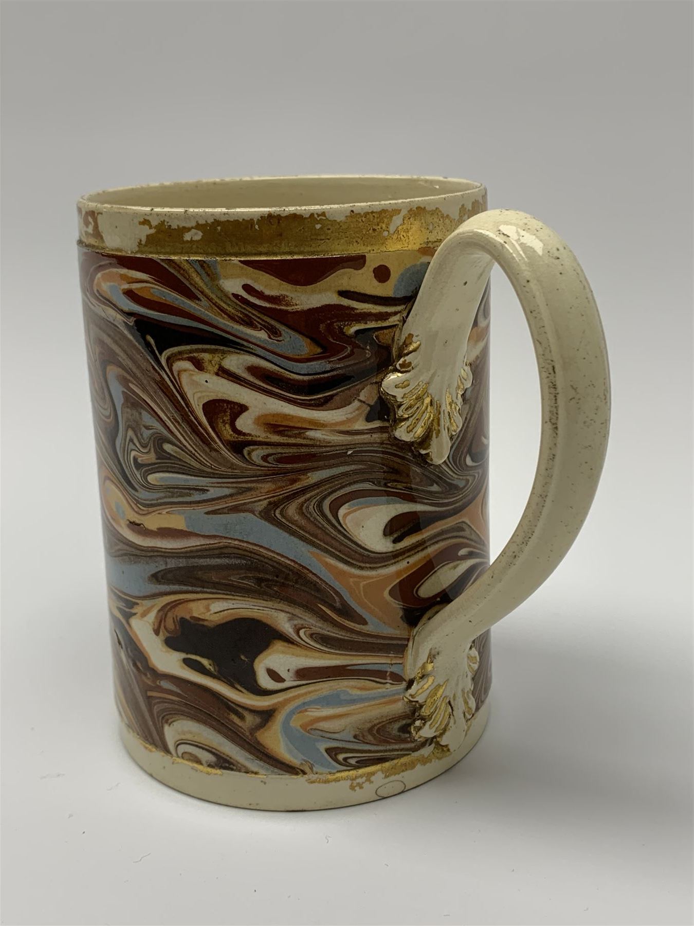 Late 18th century earthenware mug, possibly Ralph Wedgwood, Burslem or Ferrybridge, with surface marbled decoration and later gilt detail to rims and handle, impressed beneath Wedgwood & Co, H12cm