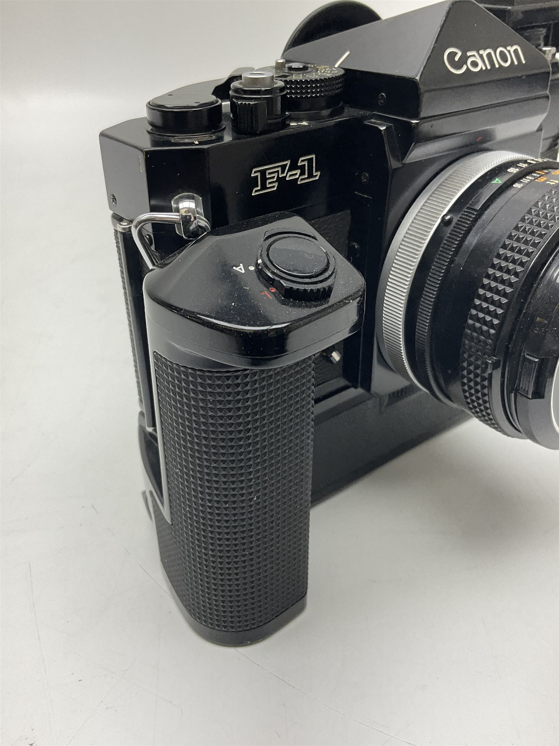 Canon F1 camera body, serial no. 136281, with 'Canon FD 50mm 1:1.8 S.C' lens, serial no.1702944 and Canon F Power winder, serial no.120072