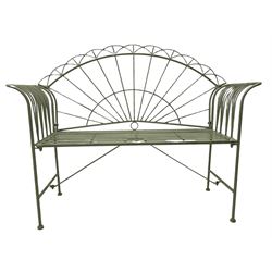 Wrought metal garden bench, painted in distressed teal 
