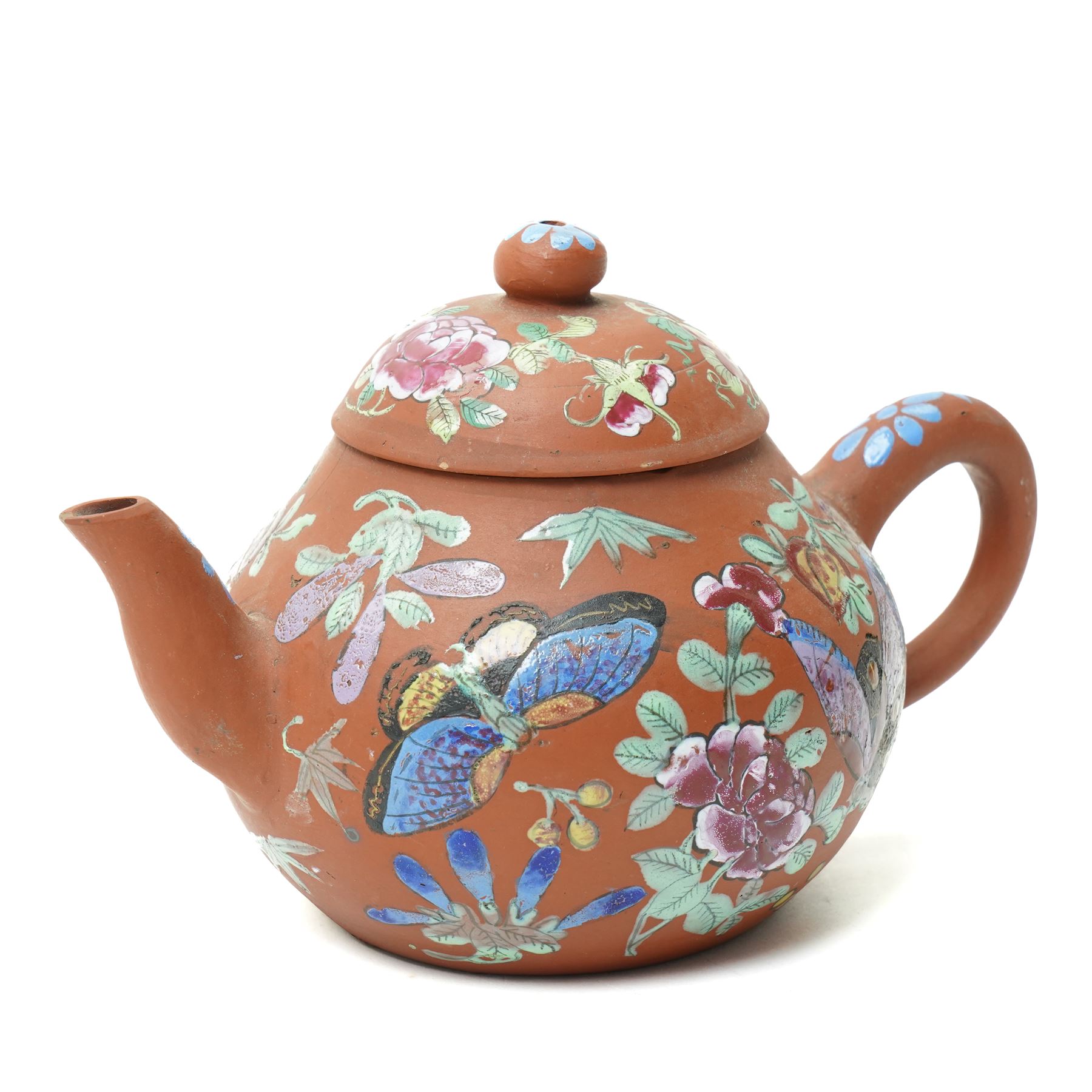 Pair of 18th century Chinese famille rose plates, painted profusely with flowers, D23cm; together with a Yixing teapot, painted with butterflies, H12cm (3)