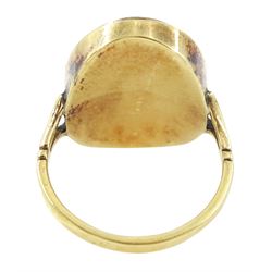 19th century gold portrait ring, set with an oval miniature of a woman wearing a pearl hairpin and earrings on ivory, under a glazed panel, set into a later gold ring with split shoulders. This lot has been registered for sale under Section 10 of the APHA Ivory Act