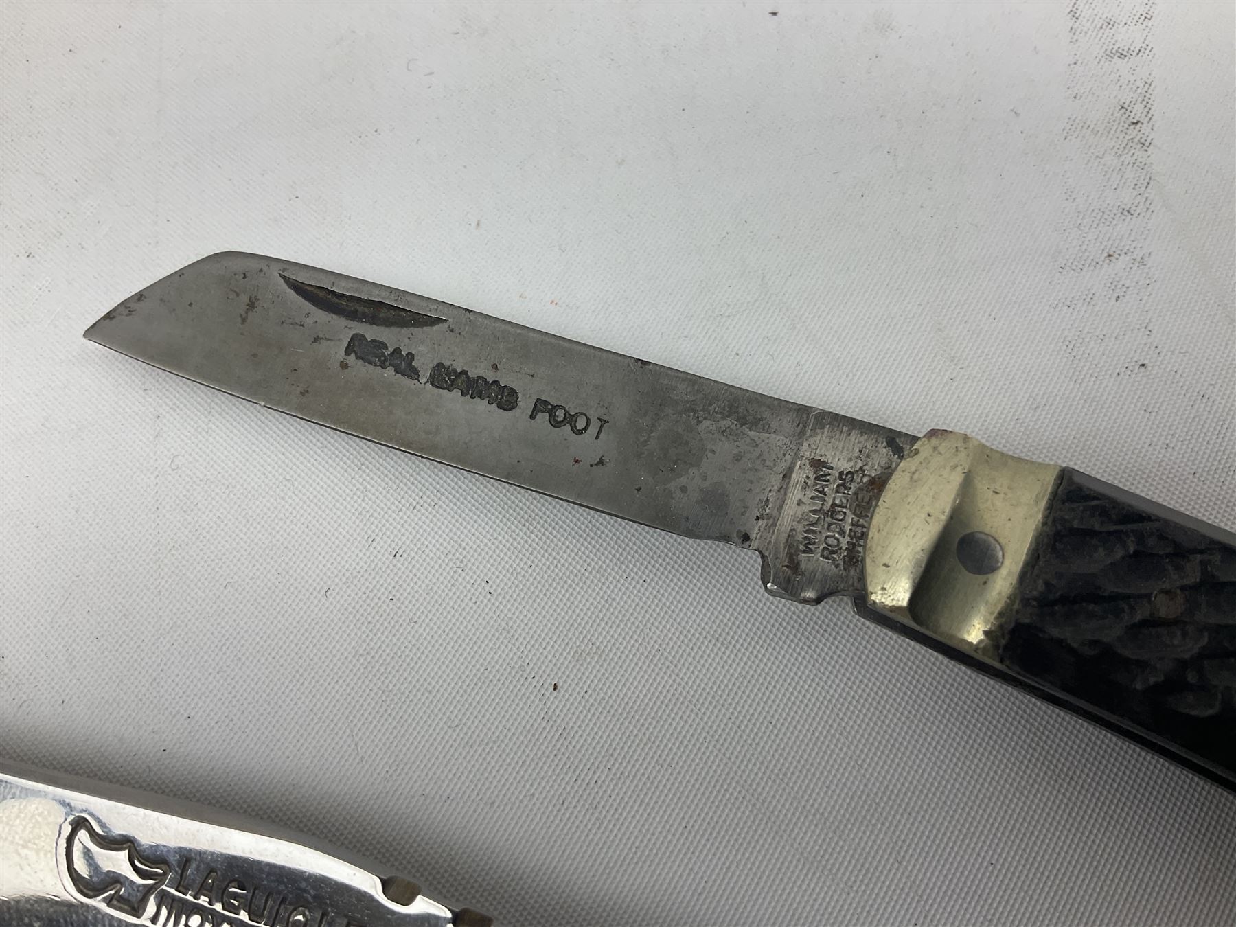 Laguiole pocket knife, with brass mounts and Bee mouche, L19.5cm open, together with a further William Rodgers Sheffield knife