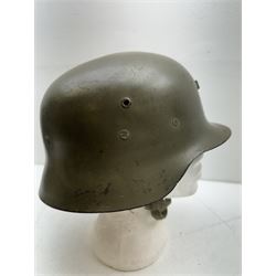 WWII Spanish combat steel helmet model Z, with leather lining and canvas strap, interior D22cm 