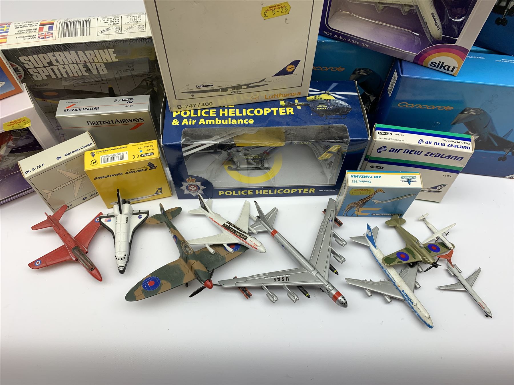 Three Schabak 1/250th scale die-cast models of Concorde, all boxed; nine boxed promotional models of airliners; Richmond Toys model of Wiltshire Police Helicopter and Air Ambulance, boxed; nine unboxed die-cast models of aircraft; and factory sealed Airfix plastic model kit of a Supermarine Spitfire VB