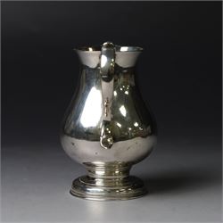 George II silver cream jug, of plain bellied form with capped scroll handle and sparrow beak, upon stepped circular foot, hallmarked London 1737, makers mark indistinct, H8.5cm
