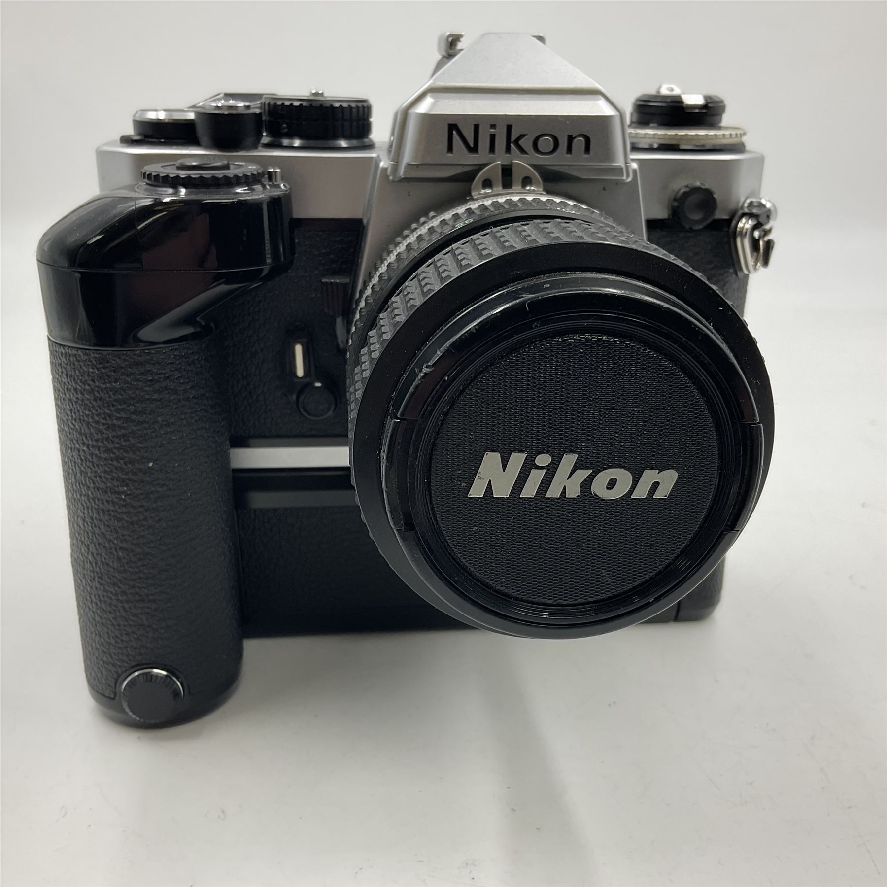 Nikon FE2 camera body, serial no. 2043167, with 'Nikon Zoom-NIKKOR 35-70mm 1:3.3-4.5' lens, serial no 3006624 and Nikon MD-12 Motor Drive, serial no. 1679037