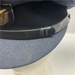 QEII RAF uniform of tunic, trousers and visor cap with Queen's Crown buttons, cuff rank braid for Flight Lieutenant, Navigator's Brevet badge, Gulf War Medal ribbon bar with MID rosette and Moss Bros. label to 'Pilot Officer K.P. Bazeley 3770 11/85'