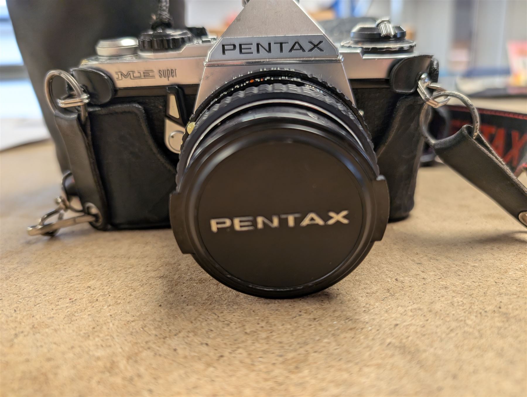 Pentax ME Super camera body, with a SMC Pentax-M 1:1.7 50mm lens and a Vivitar 28-200mm 1.3.5-5.3 Macro Focusing Zoom lens, in carry case