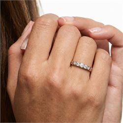 Early 20th century gold diamond ring, set with five graduating old cut diamonds, with scroll design gallery, stamped 18ct, total diamond weight approx 0.30 carat