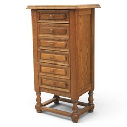 Early 20th century oak pedestal chest, with six drawers with moulded edges, raised on turned supports united by a stretcher 