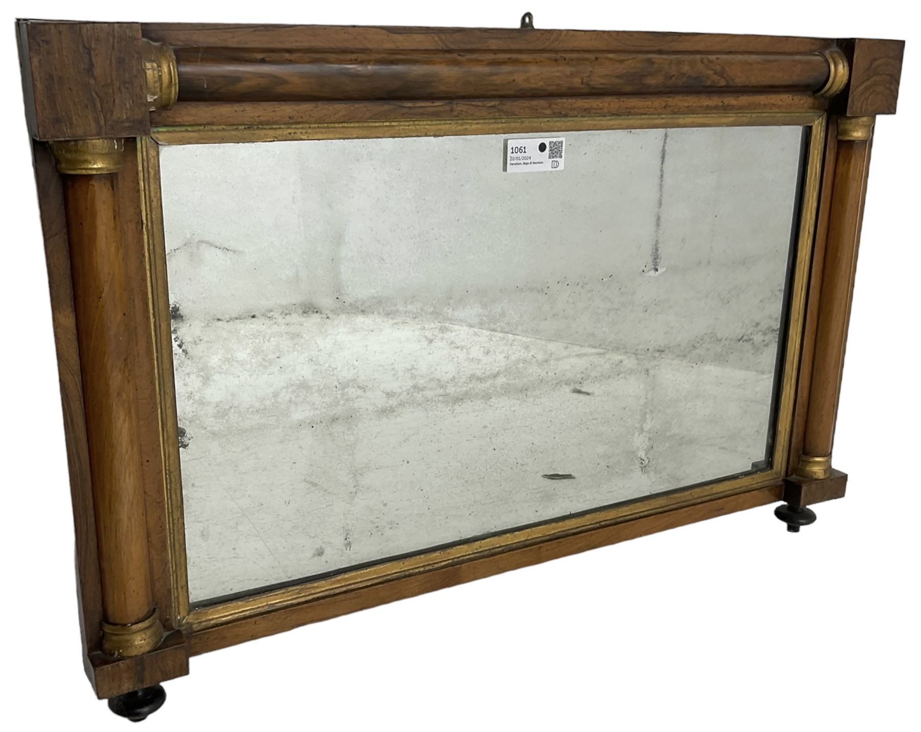 Early 19th century rosewood overmantel mirror, rectangular form with turned half pilasters, moulded gilt slip enclosing plain mirror plate, on turned feet