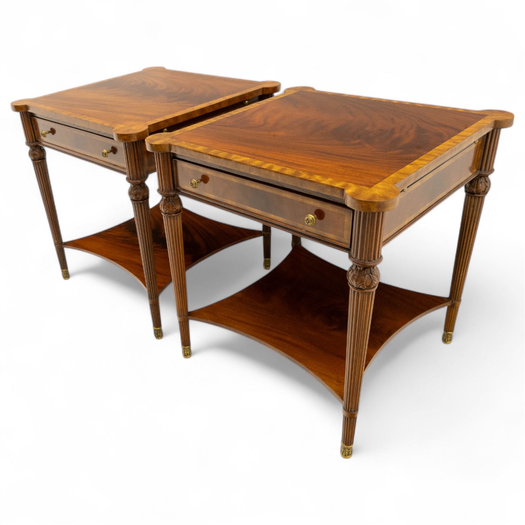 Maitland Smith - Pair of mahogany side tables, the rectangular top with rounded corners, the top edge inlaid with movingui wood, above two under-tier shelves, and frieze drawer, supported on stop-reed and acanthus foliate carved legs united by platform stretcher, raised on brass sabot foot caps