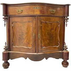 Victorian mahogany serpentine side cabinet, fitted with single drawer over panelled cupboard enclosing single shelf, raised on turned bun feet