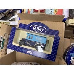 Collection of Tetley Tea collectibles to include sixteen 1:43 scale model cars from Lledo and Oxford Die-Cast with further Tetley Tea figures and tinned coaster set