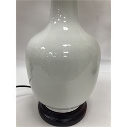 Pair of Chinese ivory crackle glazed table lamps, each of bottle form, raised upon circular hardwood base, excluding fittings H43cm