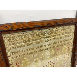 Victorian needlework sampler, depicting a band of alphabet and numbers, above verse detailed 'The heavens declare the glory of God and the firmament sheweth his handywork', with floral and foliate motifs below, worked by Isabella Summers, aged fourteen, dated 1869, framed, frame H58cm

