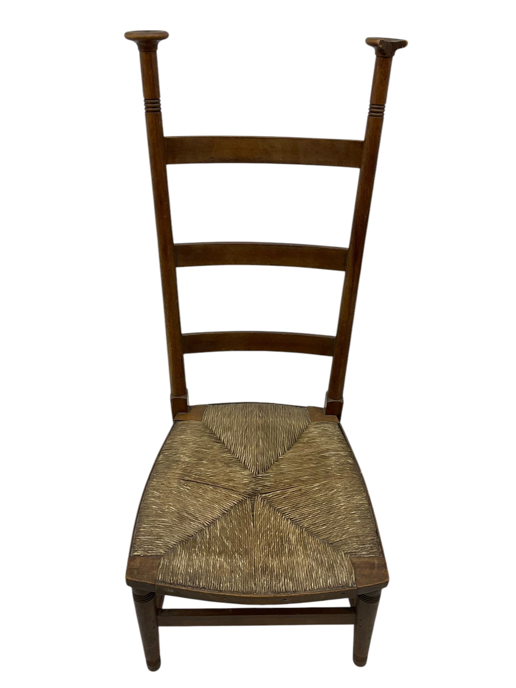 Attributed to William Birch of High Wycombe - Arts & Crafts oak ladder-back side chair, with turned finials, rush seat, and stretchers, raised on square-section supports; 19th century mahogany Pembroke table, rectangular drop-leaf top raised on turned supports with central stretcher and splayed feet