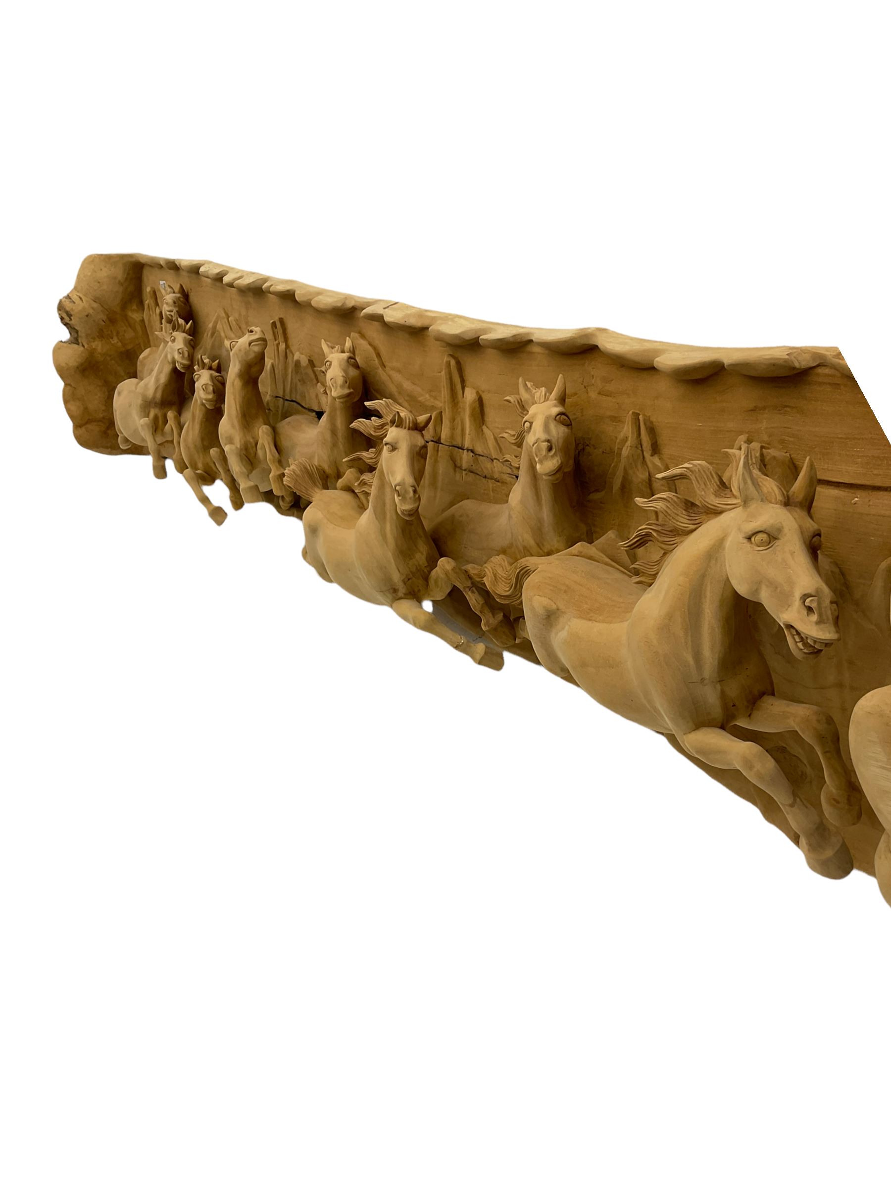 High relief carved cherry wood wall art - eight galloping horses with mountainous background