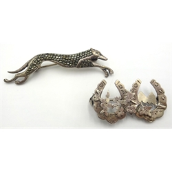  Silver charm bracelet, London 1974, marcasite grey hound brooch stamped sterling, silver horseshoe brooch hallmarked etc  