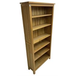 Contemporary light oak open bookcase, fitted with five adjustable shelves