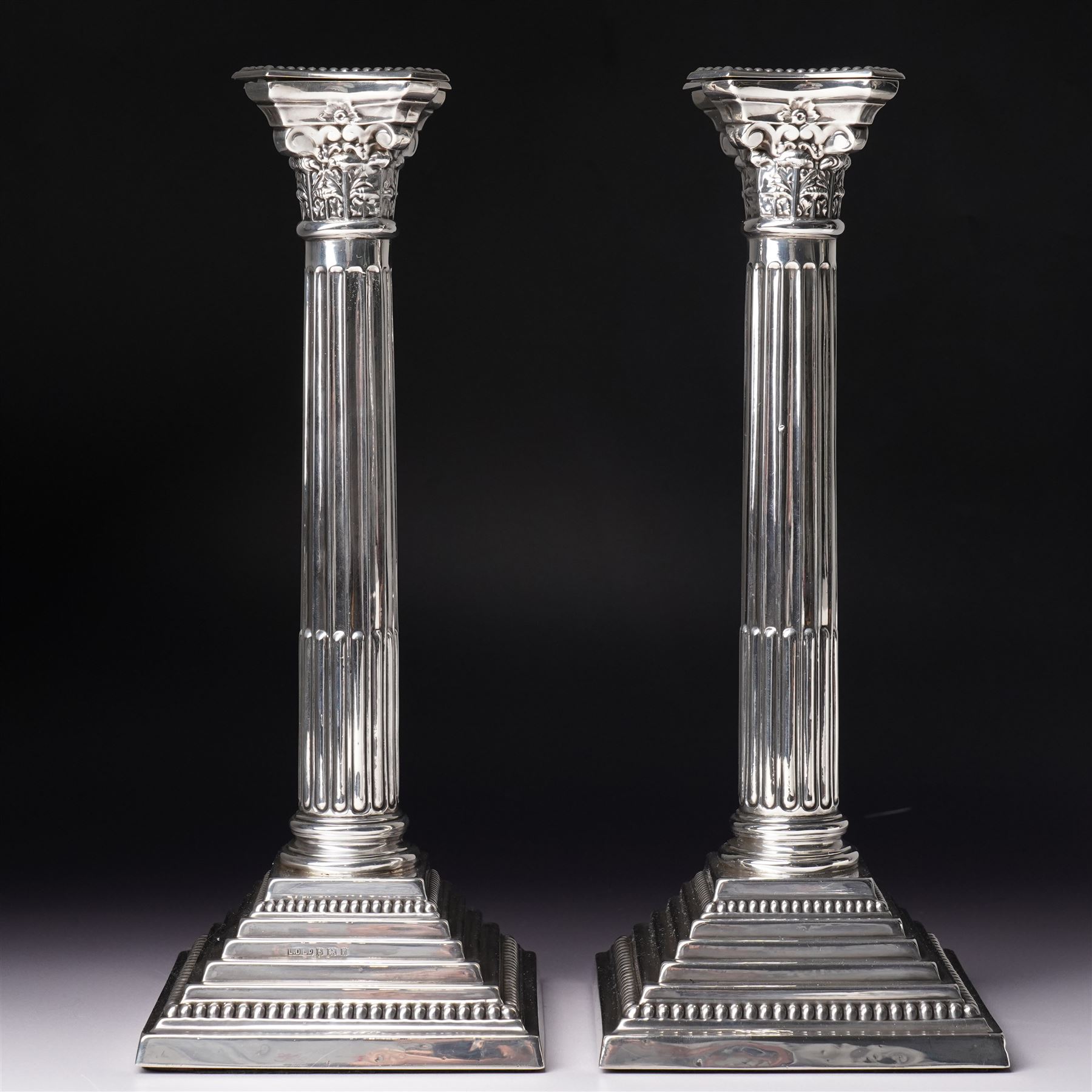 Pair of silver Corinthian column candlesticks with stepped square bases H30cm Birmingham 1968 Makers mark L.D.Ld