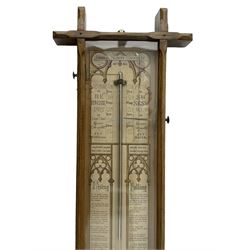 Admiral Fitzroy - Early 20th century Fitzroy barometer in a glazed gothic influenced oak case with chamfered uprights and top and base panels, full length paper scales with Fitzroy's observations and predictions, mercury bulb cistern, storm glass, spirit thermometer and brass sliding vernier pointers. Retailed by Inglis & Son, Coney Street, York.