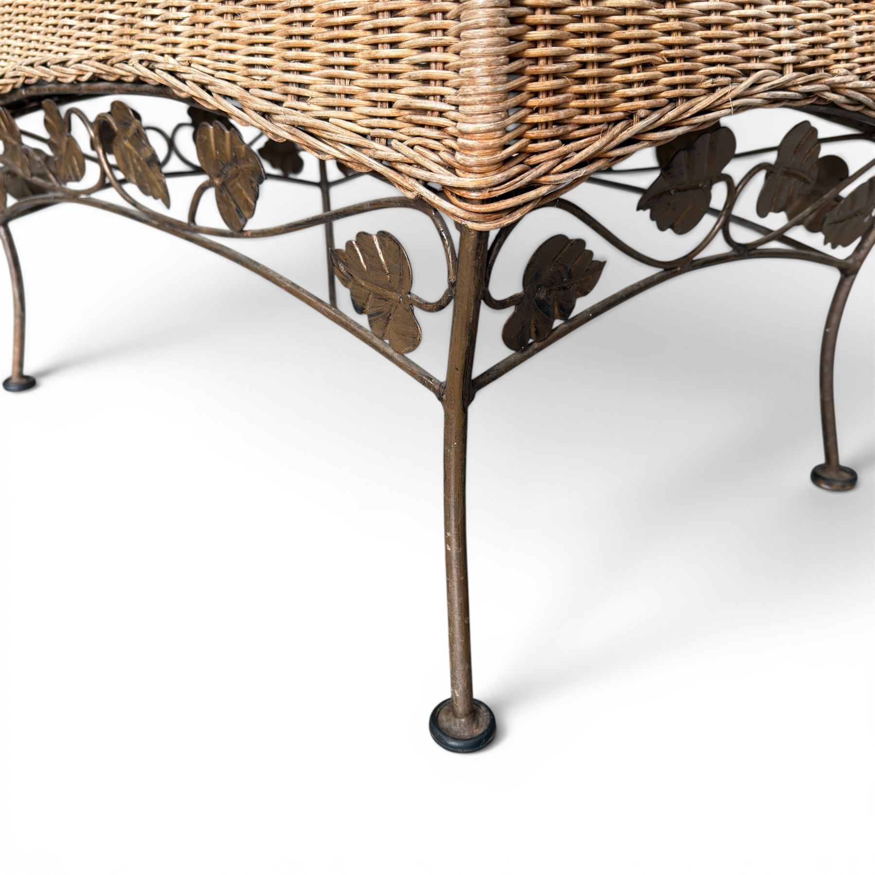 Basket work coffee table featuring scrolling leaf edging on tapered lags