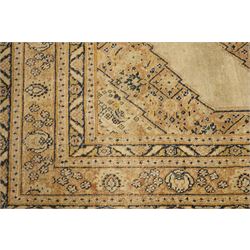 Two hand-knotted rugs, comprising Persian medallion rug and tribal rug, Persian hand-knotted rug, ivory ground centred by shaped floral medallion with pendants, surrounded by stylised flowerheads and foliate motifs, enclosed by multiple floral and geometric borders, H155cm, W123cm; tribal hand-knotted rug, dark brown ground with repeating linked geometric diamond medallions in orange and green, enclosed by ivory geometric border, striped ends with fringes, H150cm, W71cm