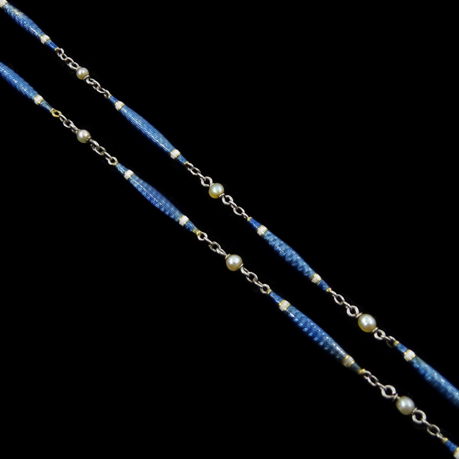 Early 20th century platinum enamel and pearl necklace, sixteen guillioche blue enamel and white enamel baton links, each spaced by a trace links and a single seed pearl