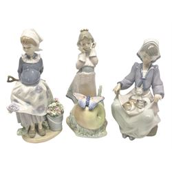 Three Lladro figures, comprising Land of Giants no 5716, Lap Full of Love no 5739 and Little Dutch Gardener no 5671, all with original boxes, largest example 22cm