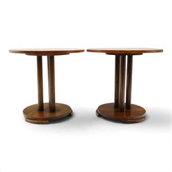 Pair of early 20th century oak lamp tables, circular tops raised on cluster-column pedestals, with circular platform bases and shaped bracket feet (2)