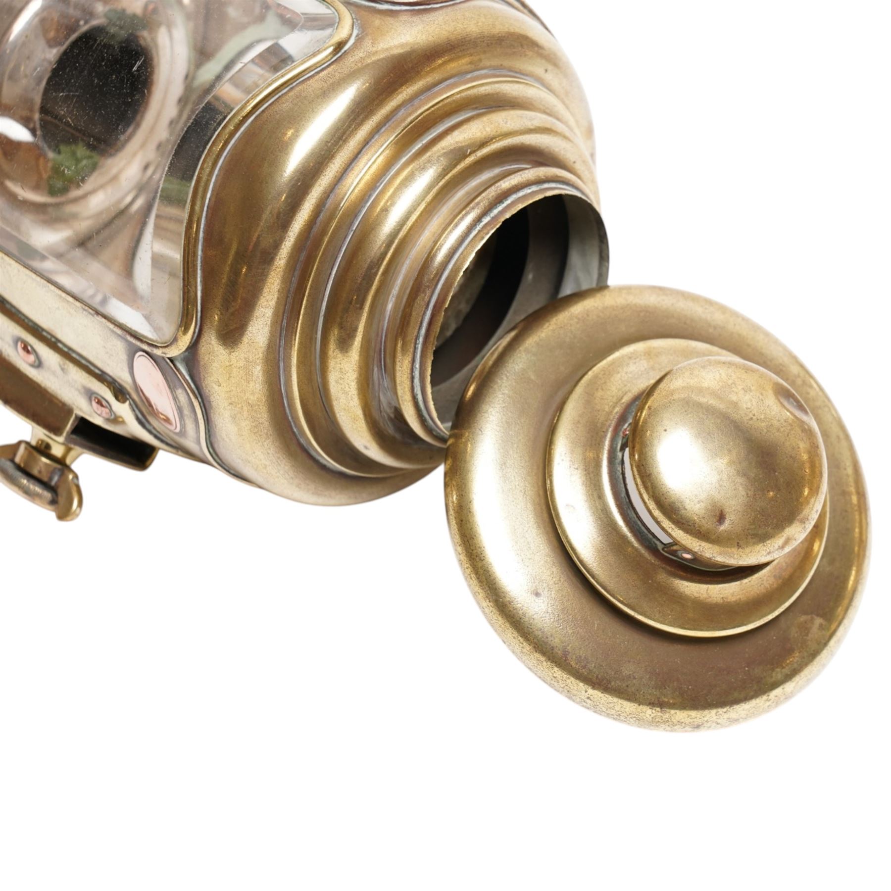 Bleriot Ltd. (London) - pair of Edwardian brass carriage lamps no.152, the body with three faceted bevelled glass panels, surmounted by brass chimney, the back mount with makers plaque below

