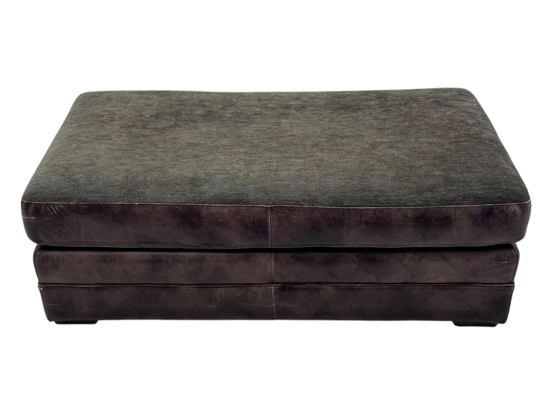 Large Knole design three-seat sofa upholstered in brown leather with scatter cushions upholstered in contrasting striped and Union Jack patterned fabric, on block feet (W210cm, H100cm, D102cm); together with matching rectangular footstool (135cm x 75cm, H45cm)