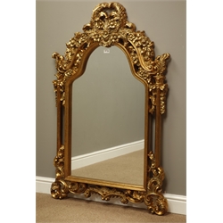 Ornate wall mirror in gilt frame with shaped top, W90cm, H140cm