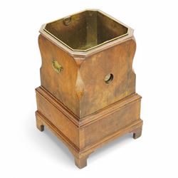 George III figured walnut champagne or wine cooler, of stepped square form with ogee cut-outs, fitted with two drawers, shaped handle plates with engraved decorated to each side, with brass liner, on bracket feet 
