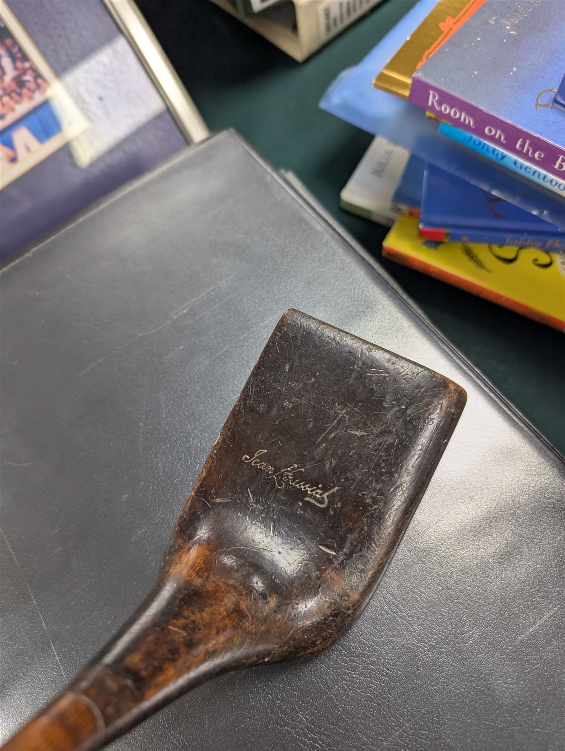 Jean Gassiat Persimmon putter, with half brass sole plate, hickory shaft, bound leather pistol grip, L87cm