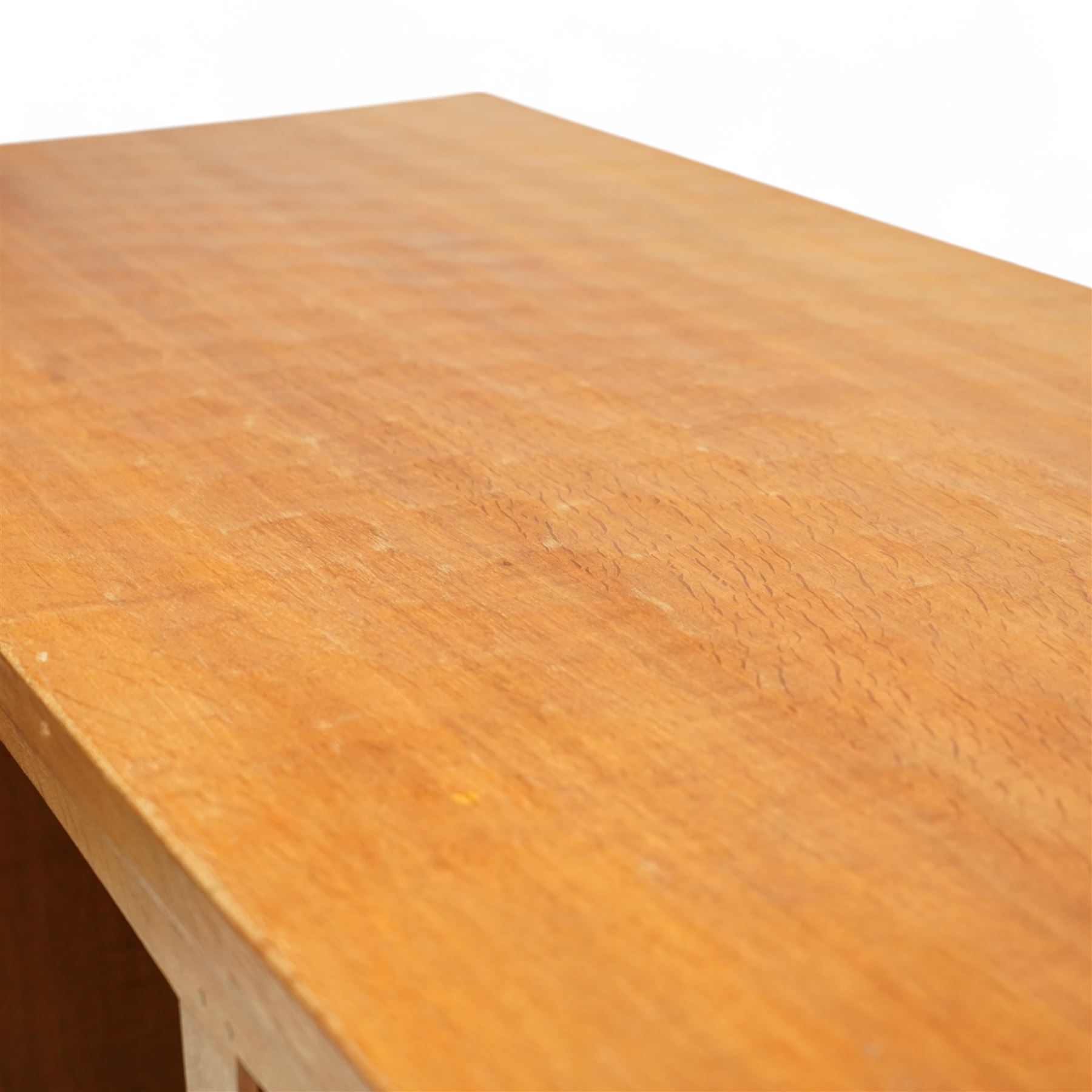 Mouseman - oak pedestal kneehole desk, adzed rectangular top over twin pedestals each fitted with three drawers, arched kneehole with panelled interior, on plinth base, signature carved mouse to side, by the workshop of Robert Thompson, Kilburn