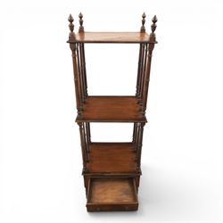 Late Victorian mahogany whatnot, the three tiers supported by turned spindle uprights with turned finials, fitted with a single frieze drawer, raised on turned supports with brass castors