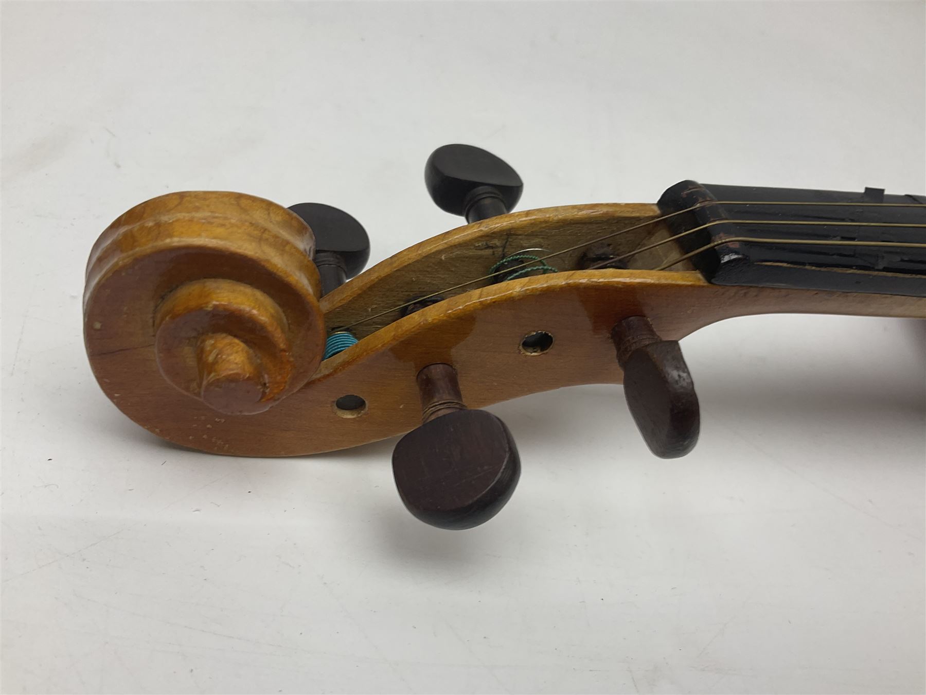Four Chinese graduated violins - full size with 35.5cm two-piece back; three-quarter size with 33.5cm two-piece back; half size with 31cm two-piece back; and quarter size with 27.5cm two-piece back; all cased except full size; one with bow (4)
