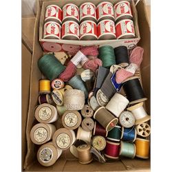 Twelve boxed sets of Clark's Anchor Fast Colour Stranded Cotton displayed on Perspex stand, together with various other cottons and threads in three boxes