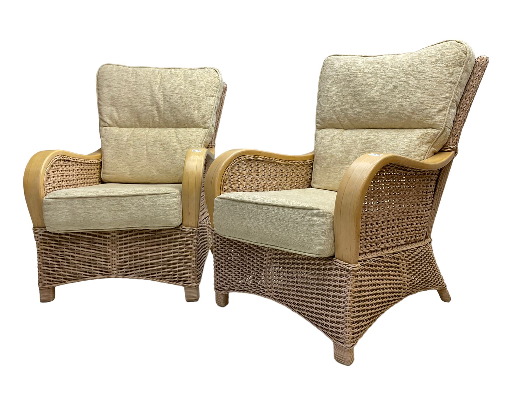Contemporary rattan conservatory suite - two seat sofa with wicker frame and loose cushions upholstered in textured champagne fabric (W125cm H98cm); pair of matching armchairs (W72cm H98cm); rectangular glass-topped coffee table with rattan frame and undertier (W85cm D60cm H47cm); and matching square side table (W53cm H55cm)