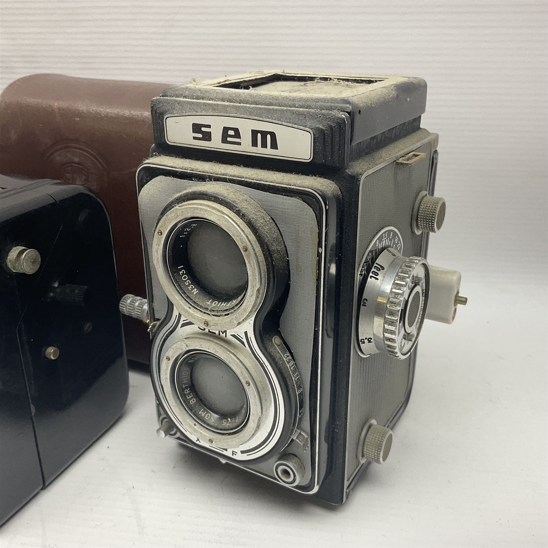 Franke & Heidecke Rolleicord twin lens camera, serial number 012706 with Heidoscop-Anastigmat f=7.5cm' lens and a 'Carl Zeiss Jena Triotar 1:4.5 f=7.5cm' lens, serial no 1474898, together with three similar cameras, including SEM TLR, serial no 420218, Ising Pucky box and Ferrania Elioflex, three in leather carry cases